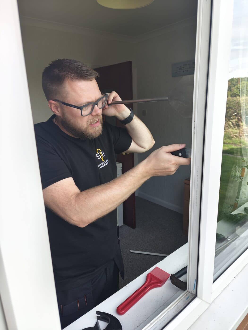 Stuart Haywood working on a uPVC door