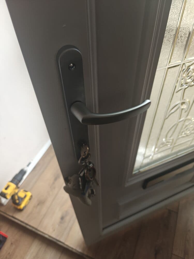 A newly fitted handle and euro cylinder on a composite front door